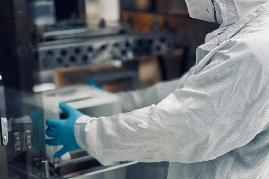 person processing in cleanroom